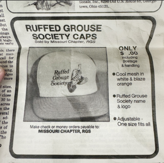 RGS Throwback orange and white trucker cap.